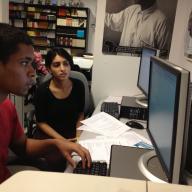Double Discovery Center senior Jeremy Luna working with DDC volunteer Rubab Rehman '15 on a college scholarship application. Rehman worked with the Center's "Scholarship Saturdays" program,which assisted high school seniors with researching scholarship opportunities and drafting their essays. Photo: Lisa Herndon