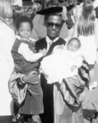 White holds his sons Alfred and Michael as he graduates from Columbia Law in 1973