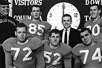 Roberts (20) with members of the 1964 Columbia football team