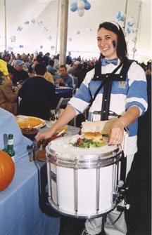 A member of the Cleverest Band in the World finds a convenient place to rest her food.