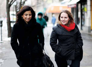 Nadia Majid ’02 (left) and Victoria Fox ’12 take a walk around Morningside Heights.