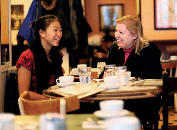 Elizabeth Chu ’12 (left) and Dr. Laura Brumberg ’87 meet for coffee and conversation at Le Monde.