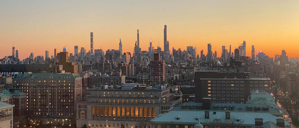 View of the Columbia Camps at sunset with NYC skyline int he distance