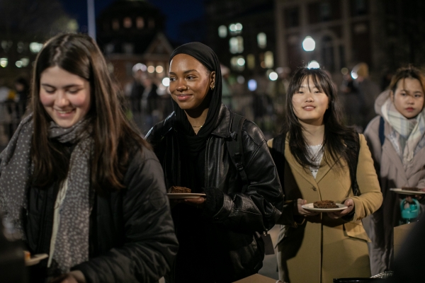 Students queue up for hot chocolate at Tree Lighting 2023.