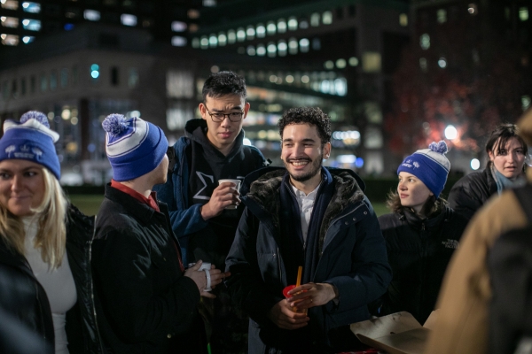 Students mingle at Tree Lighting.