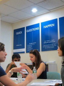 Career counselors answer students' questions at the inaugural CCE open house.