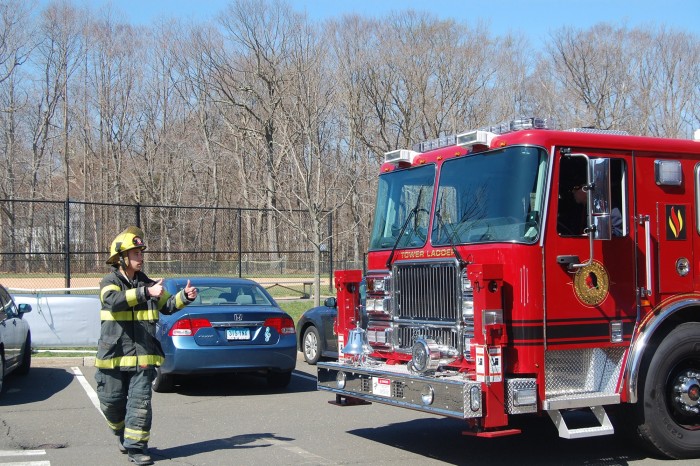 Will Cornacchia CC '17 positions a ladder truck for operation. PHOTO: Dan Anderson of Darien Fire Department