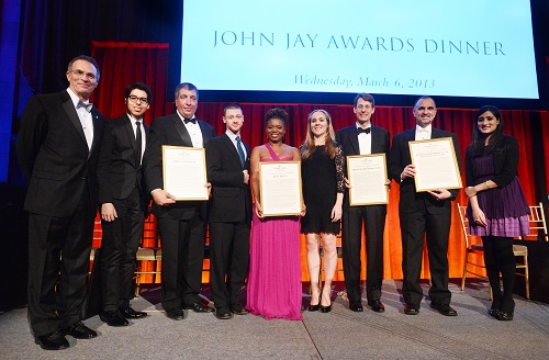 Dean James J. Valentini (far left), along with the John Jay Scholars who presented the honorees with their awards, and the honorees, at the dinner. Left to right, Bryan Terrazas CC ’13; Thomas W. Cornacchia CC ’85; Ethan Kogan CC ’13; Katori Hall ’03; Ariana Lott CC ’13; Michael J. Schmidtberger CC ’82, LW ’85; George D. Yancopoulos M.D. Ph.D., CC ’80, GSAS ’86, P&S ’87; and Tehreem Rehman CC ’13. PHOTO: EILEEN BARROSO