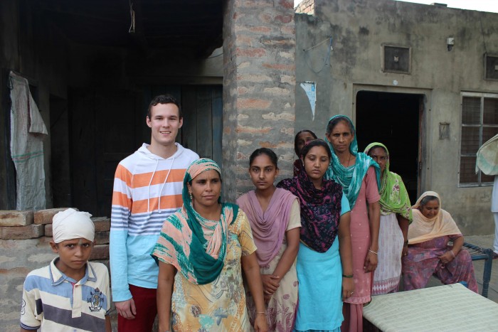 Chris Canales CC '14 with rural community members in Punjab. PHOTO: Angad Singh CC '16