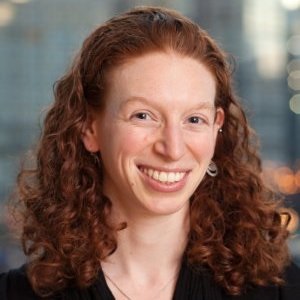 A smiling redheaded woman