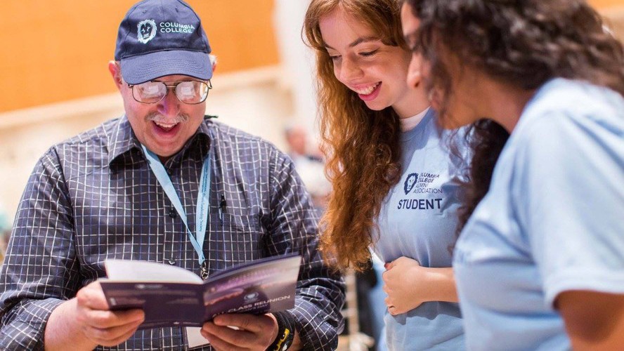 Photo of alum with students at Reunion 