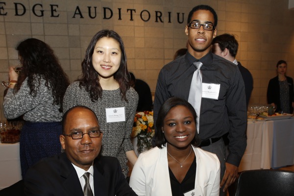 Seated: Kevin C. Matthews ’80, P: ’10, ’12, Camille J. Sanches ’18; standing: Gloria Hong ’15 and Lorenzo Bradford ’17
