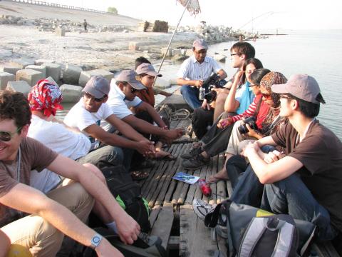 Students from Columbia and the University of Dhaka tour the damaged embankment at Sirajganj from the river. Photo: Michael Steckler