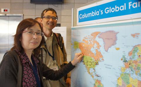 More than 1,000 friends and family members came to Columbia from hometowns across the globe to participate in Family Weekend and spend time with their favorite student. Here, parents place a pin in the location of their hometown on a world map after checking in for Family Weekend. Photo: Kat Cutler