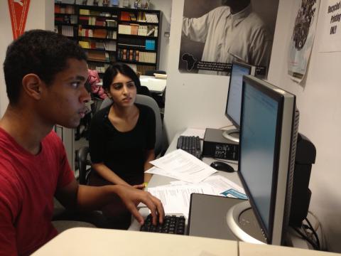 Double Discovery Center senior Jeremy Luna working with DDC volunteer Rubab Rehman '15 on a college scholarship application. Rehman worked with the Center's "Scholarship Saturdays" program,which assisted high school seniors with researching scholarship opportunities and drafting their essays. Photo: Lisa Herndon