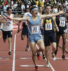 Liam Boylan-Pett ’08 crosses the finish line at the Penn Relays. 