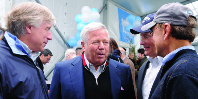 (Left to right) President Lee C. Bollinger, Robert K. Kraft ’63, Trustees Chair Bill Campbell ’62 and Phil Satow ’63 meet under the Big Tent. Photo: Eileen Barroso