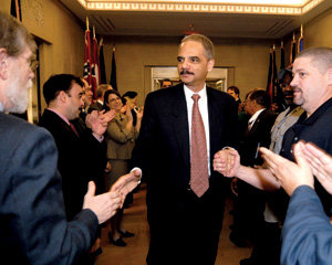 Holder was warmly greeted by Justice Department staff members as he arrived for his first day of work. PHOTO: COURTESY OF THE DEPARTMENT OF JUSTICE