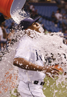 Perez is doused by a teammate after scoring the winning run during a regular-season game after his call-up in September. Photo: Tampa Bay Rays – Skip Milos