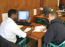 A student gets one-on-one tutoring at the new Writing Center. Photo: Eileen Barroso