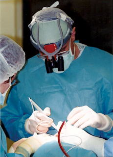 Dr. Francis Collini ’78 operates on a child with a cleft palate.