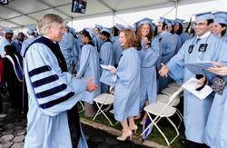 (From top) Class Day speaker Alexandra Wallace Creed ’88, s.v.p. of NBC News, urges graduates to “follow your passion”; Class of 1961 alumni (left to right) Frank Lorenzo, Burtt Ehrlich and James Ammeen, as members of the 50th anniversary graduating class, hand out pins to the graduating seniors; Class of 1986 alumni Renan Pierre (left) and Rick Wolf proudly carry their class banner in the Alumni Parade of Classes; salutatorian Elizabeth Lucia Lyon ’11 addresses her classmates; and President Lee C. Bollinger offers his congratulations to the graduating seniors. Photos: Eileen Barroso
