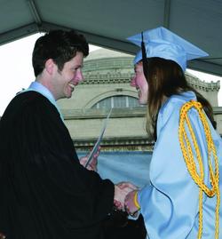 Dean of Student Affairs Kevin Shollenberger presents the Edward S. Brainard Memorial Prize to Sarah Weiss ’10 at the 2010 Class Day ceremony.