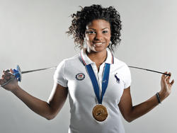 Fencer Nzingha Prescod ’15, who is currently ranked No. 1 in the United States and eighth in the world, with her gold medal from the 2011 Junior World Championships, held in Amman, Jordan. Photo: Mike Dote