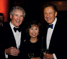 University Trustees Chair Bill Campbell ’62 with Kassie and Carlos Muñoz ’57.PHOTO: Eileen Barroso