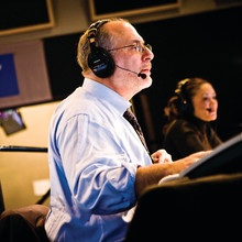 Siegel, with All Things Considered co-host Michelle Norris in the background, brought a personal touch to his network’s coverge of the terrorist attack on the World Trade Center. Photo: © 2008 NPR, by Stephen Voss