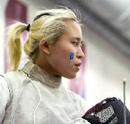 Margaret Lu '17 looks into the distance at a fencing tournament.