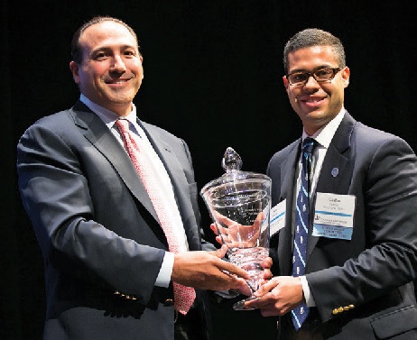 Two men with a trophy