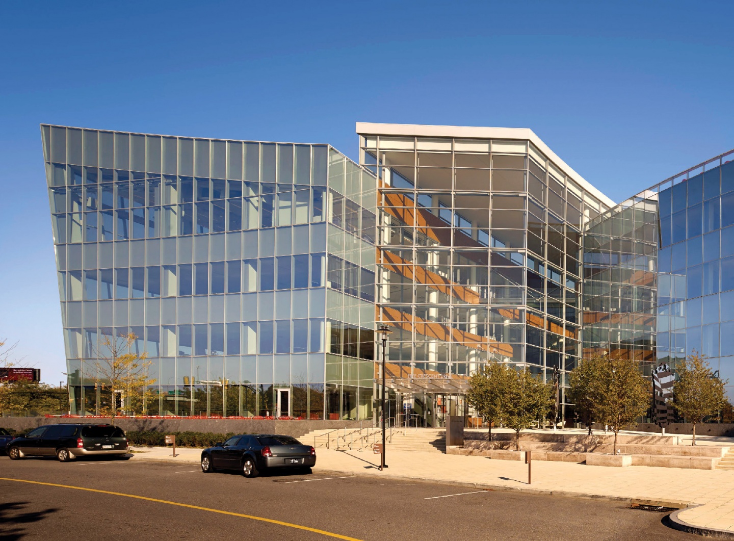 A glass, asymmetrical building