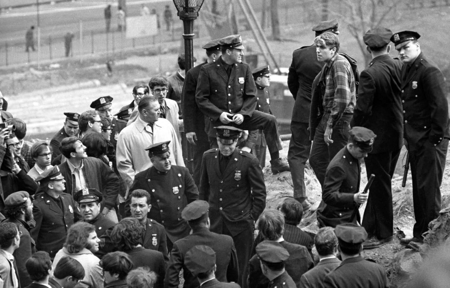 Mark Rudd ’69 (right) in Morningside Park. After a brief clash with the NYPD, students returned to campus and occupied Hamilton Hall.