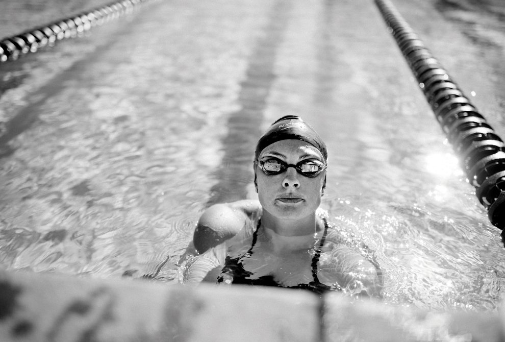 Katie Meili ’13 shown in a swimming pool wearing goggles