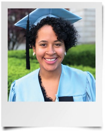A curly-haired woman in a Columbia cap and gown