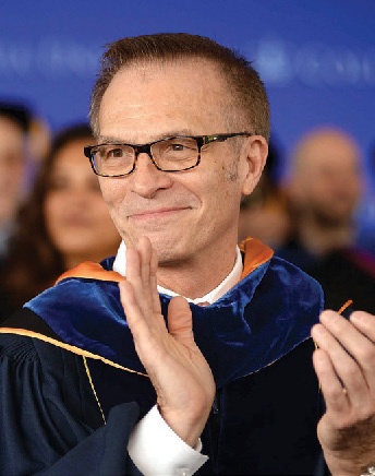 Columbia College Dean James J. Valentini applauds during Class Day.