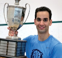 Osama Khalifa '18 poses with a trophy from the College Squash Association.