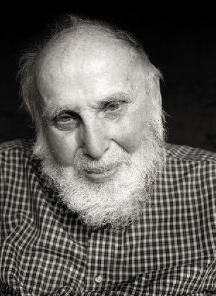an elderly man with a white beard