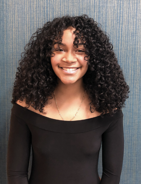 a young woman with curly hair