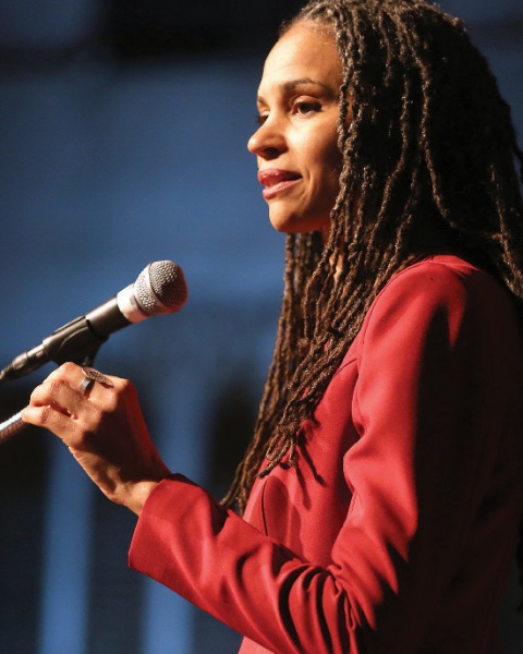 A woman at a microphone