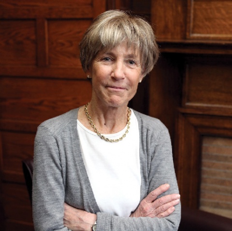 A woman in a grey cardigan