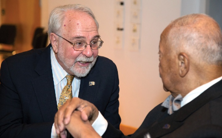 Roger Lehecka ’67, GSAS’74 greets former NYC mayor David Dinkins at the Double Discovery Center ceremony renaming it in Lehecka’s honor.