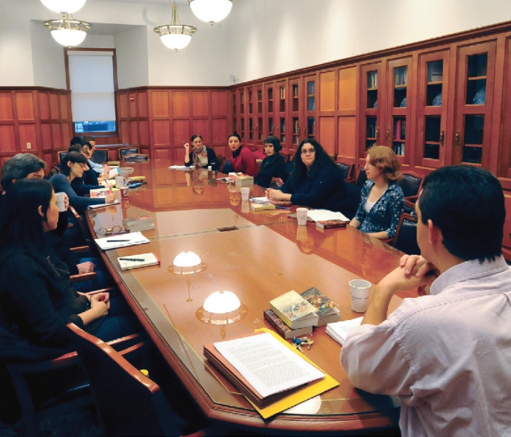 A group of men and women around a conference table