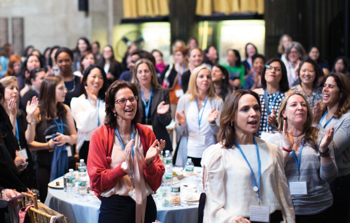 Attendees of the Columbia College Women's Symposium give a standing ovation.