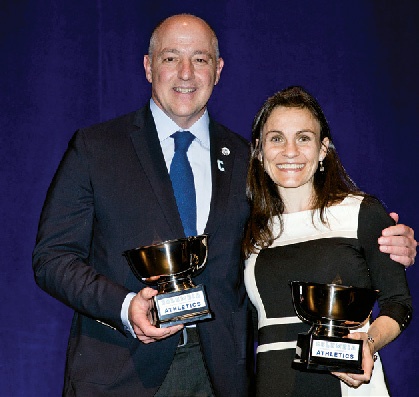 Peter Leone ’83 and Rachel Flax Kaplan ’03 pose together with their Athletics Alumni Awards.