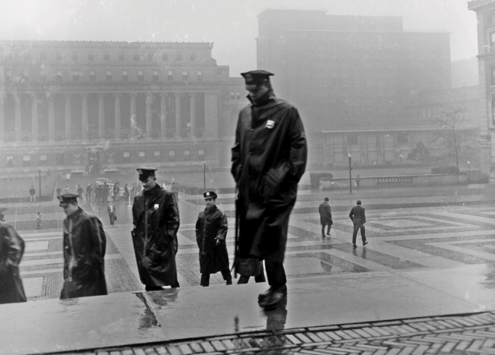 police in rain gear on campus