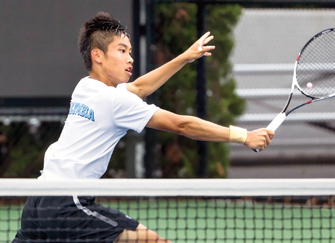 a young man playing tennis