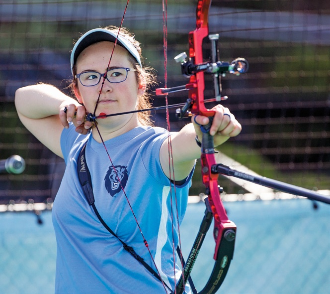 a woman with a crossbow