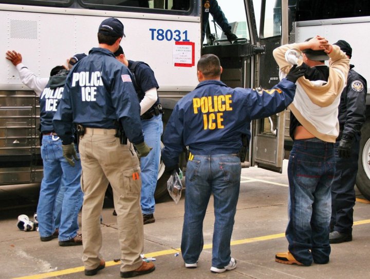 men wearing POLICE ICE jackets